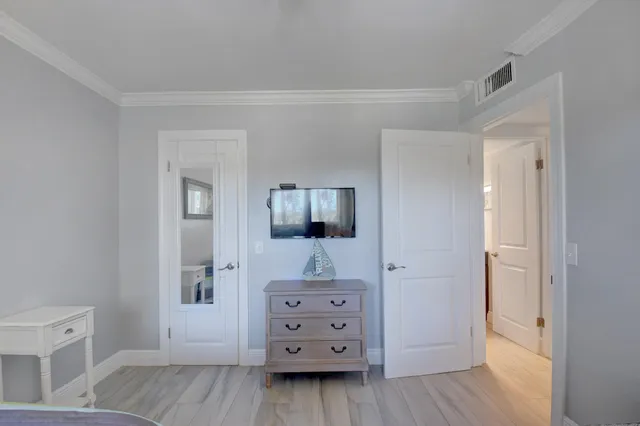 a bathroom with a sink a toilet a mirror a vanity and shower