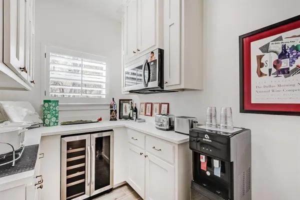 a kitchen with stainless steel appliances a sink stove and cabinets