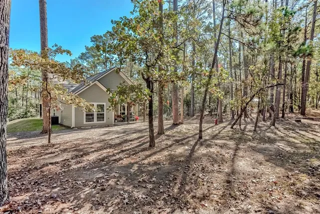 a picture of a room with a large white bed