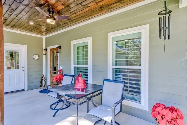 a view of a livingroom with furniture and window