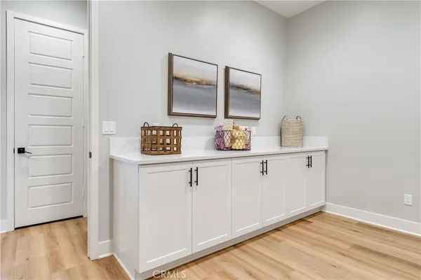 a bedroom with two beds and a table