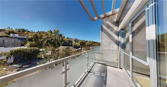 a view of balcony with two chairs