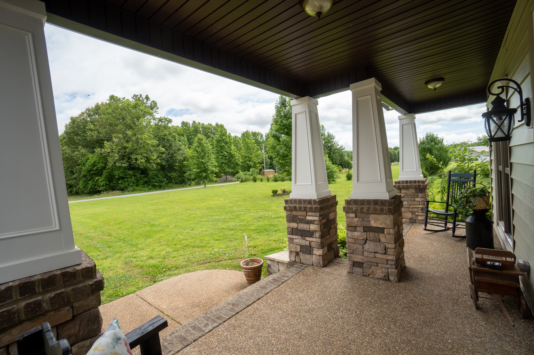2635 Friendship Road Cross Plains, TN 37049 - Photo 3 of 48 a view of a patio with table and chairs next to a yard