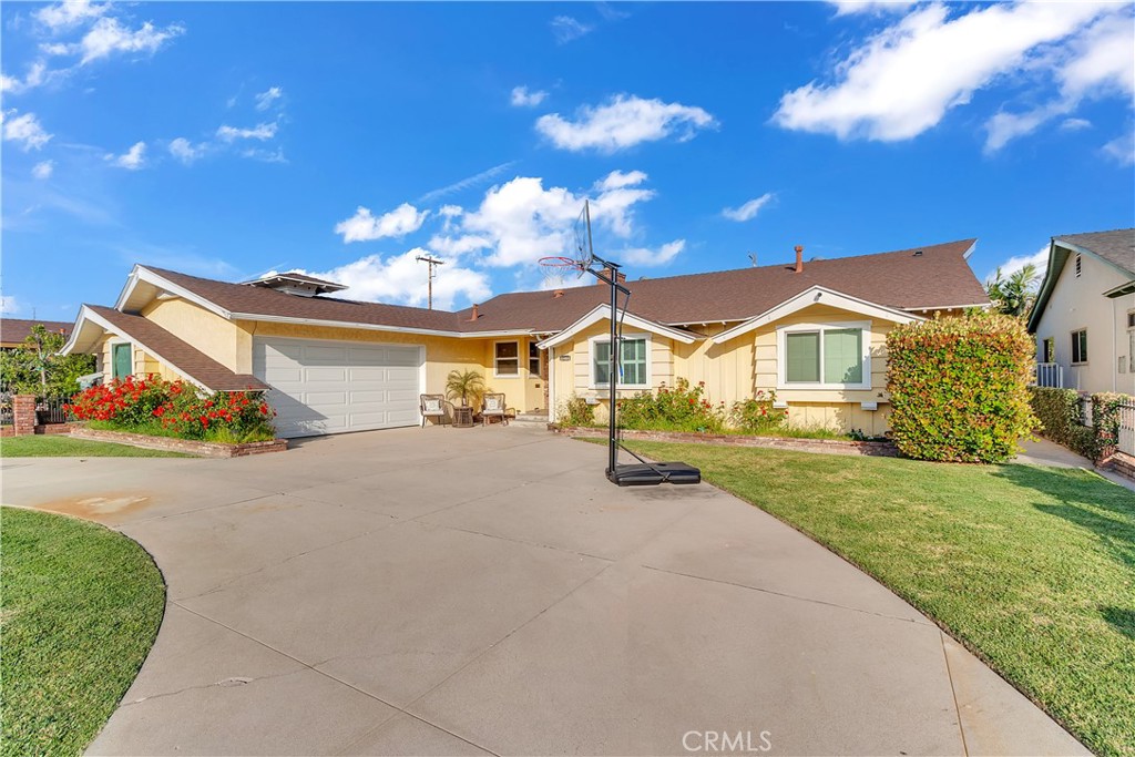 11460 Samoline Avenue Downey, CA 90241 - Photo 2 of 30 a view of an house with backyard and a tree