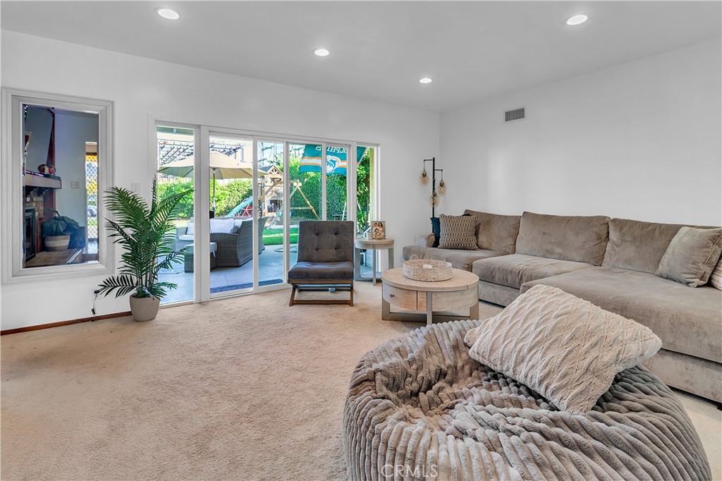11460 Samoline Avenue Downey, CA 90241 - Photo 23 of 30 a living room with furniture and a potted plant