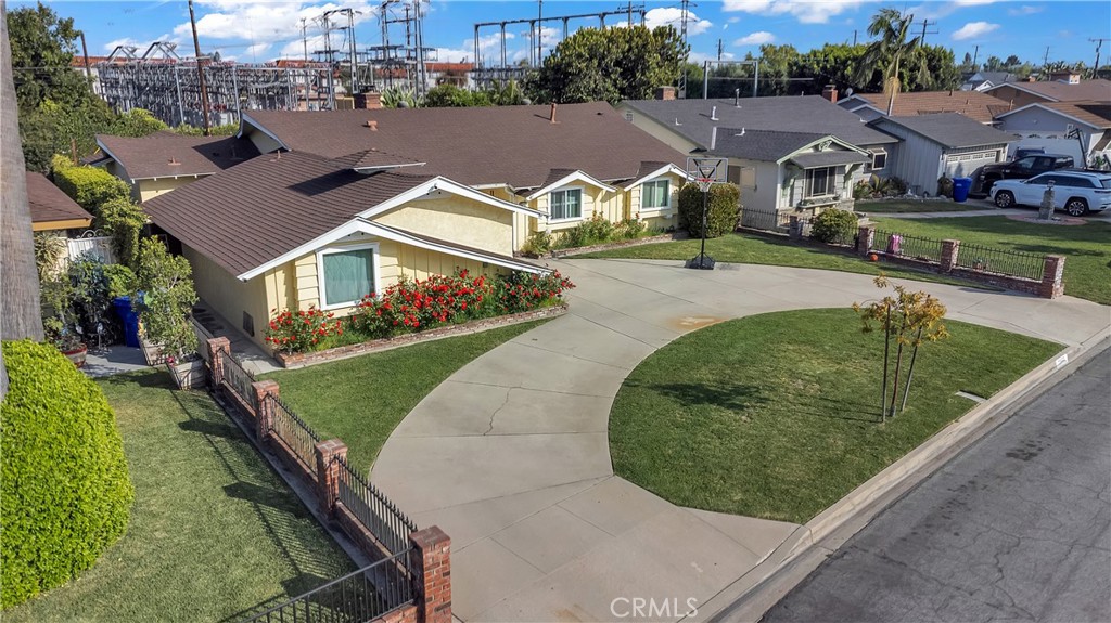 11460 Samoline Avenue Downey, CA 90241 - Photo 4 of 30 a view of multiple houses with a yard