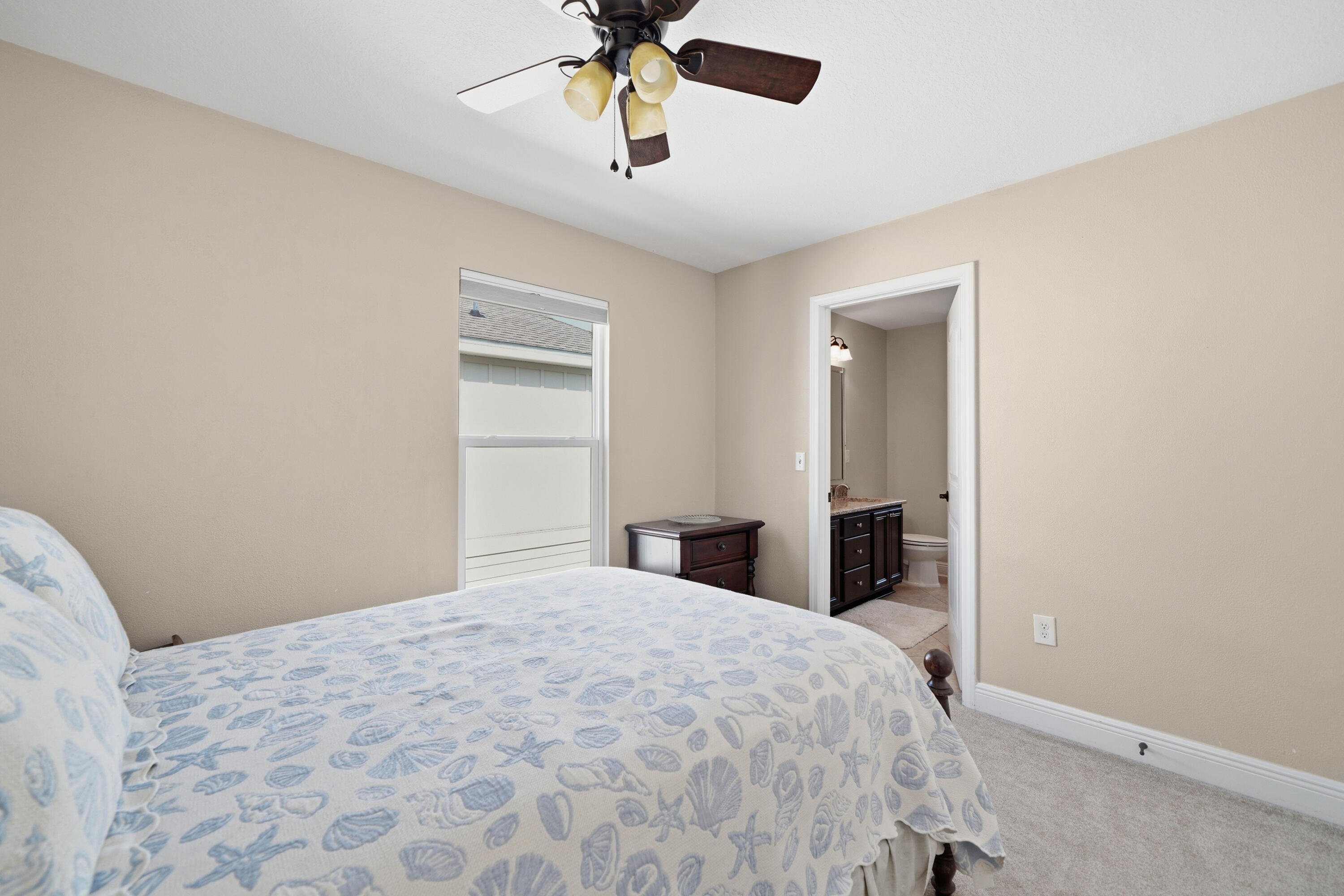 135 Grayling Way Inlet Beach, FL 32461 - Photo 14 of 61 a bedroom with a large bed and a chandelier