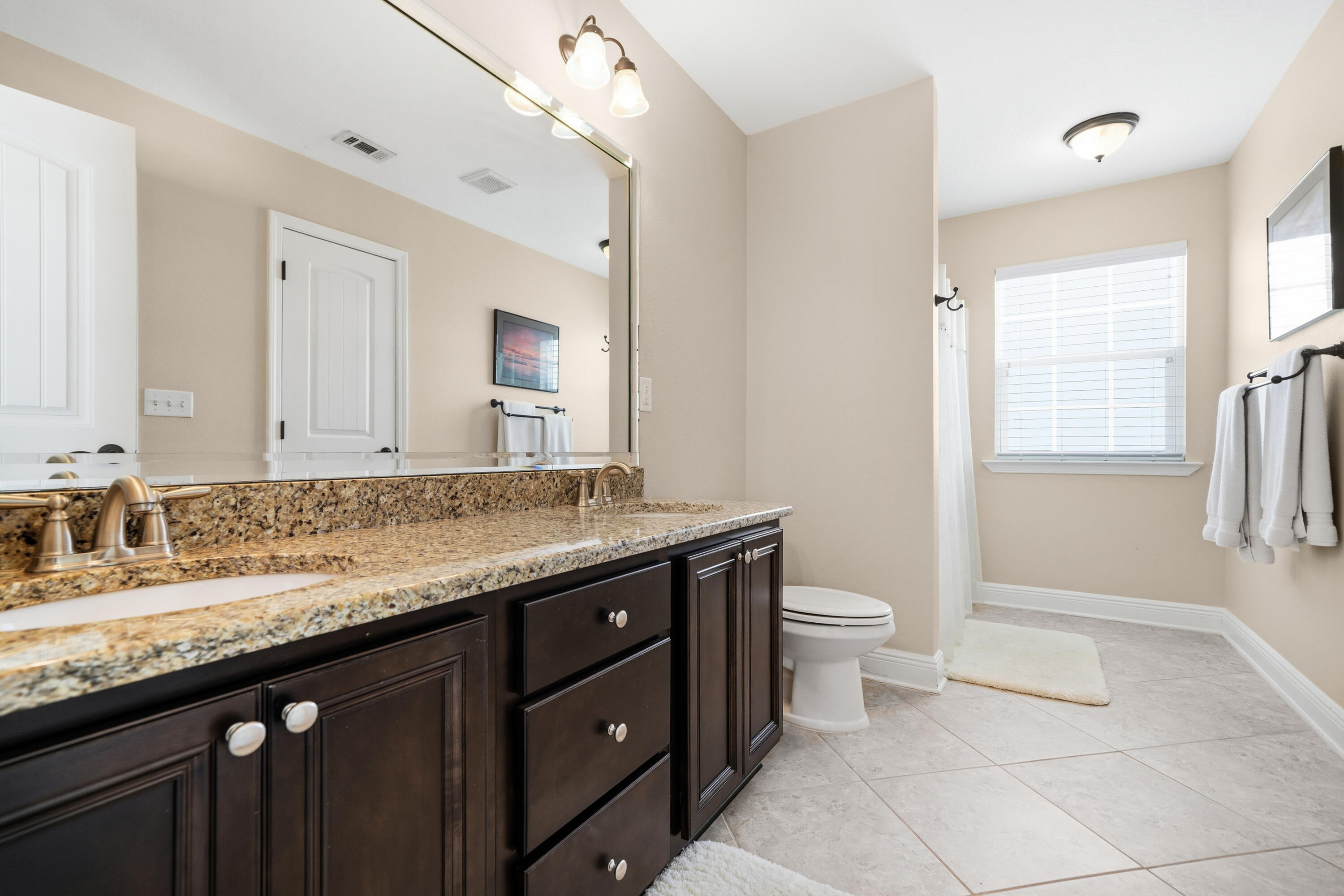 135 Grayling Way Inlet Beach, FL 32461 - Photo 17 of 61 a bathroom with a granite countertop sink toilet and mirror