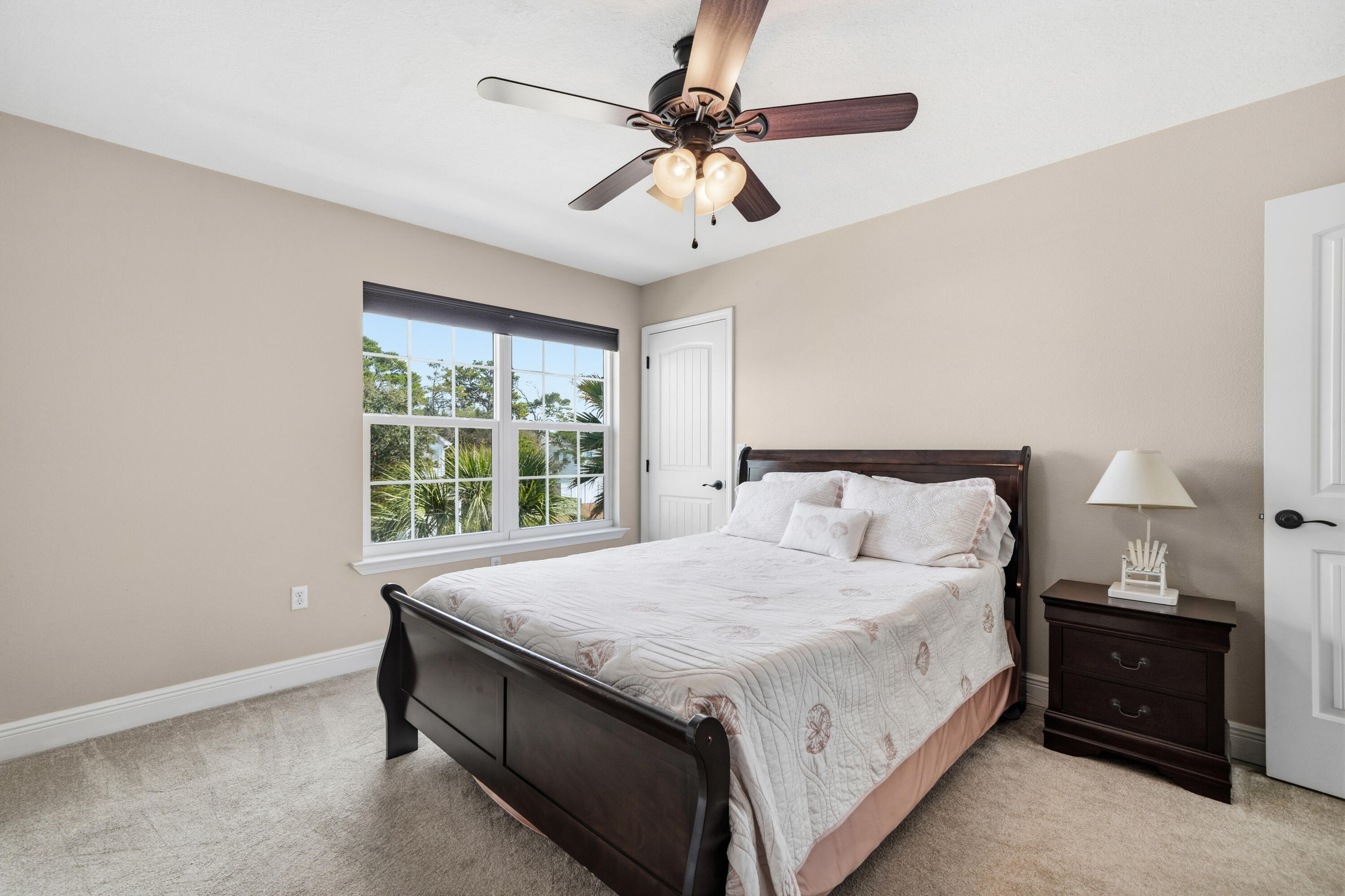 135 Grayling Way Inlet Beach, FL 32461 - Photo 20 of 61 a bedroom with a bed and a chandelier