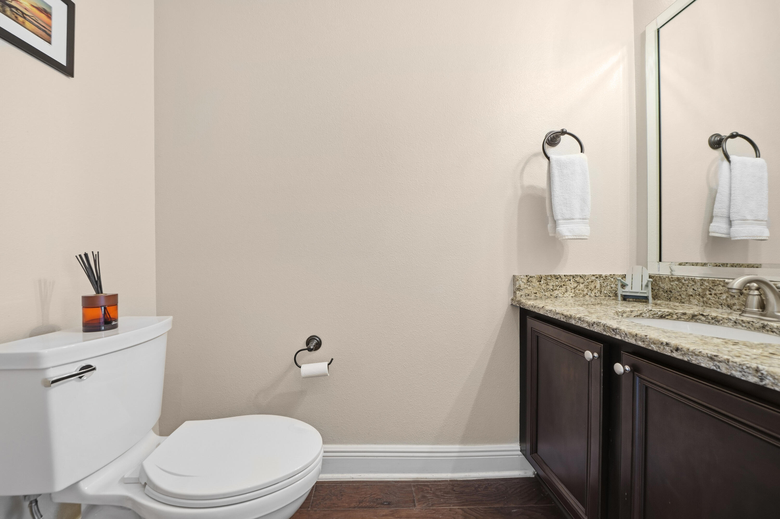 135 Grayling Way Inlet Beach, FL 32461 - Photo 25 of 61 a bathroom with a granite countertop toilet sink and mirror