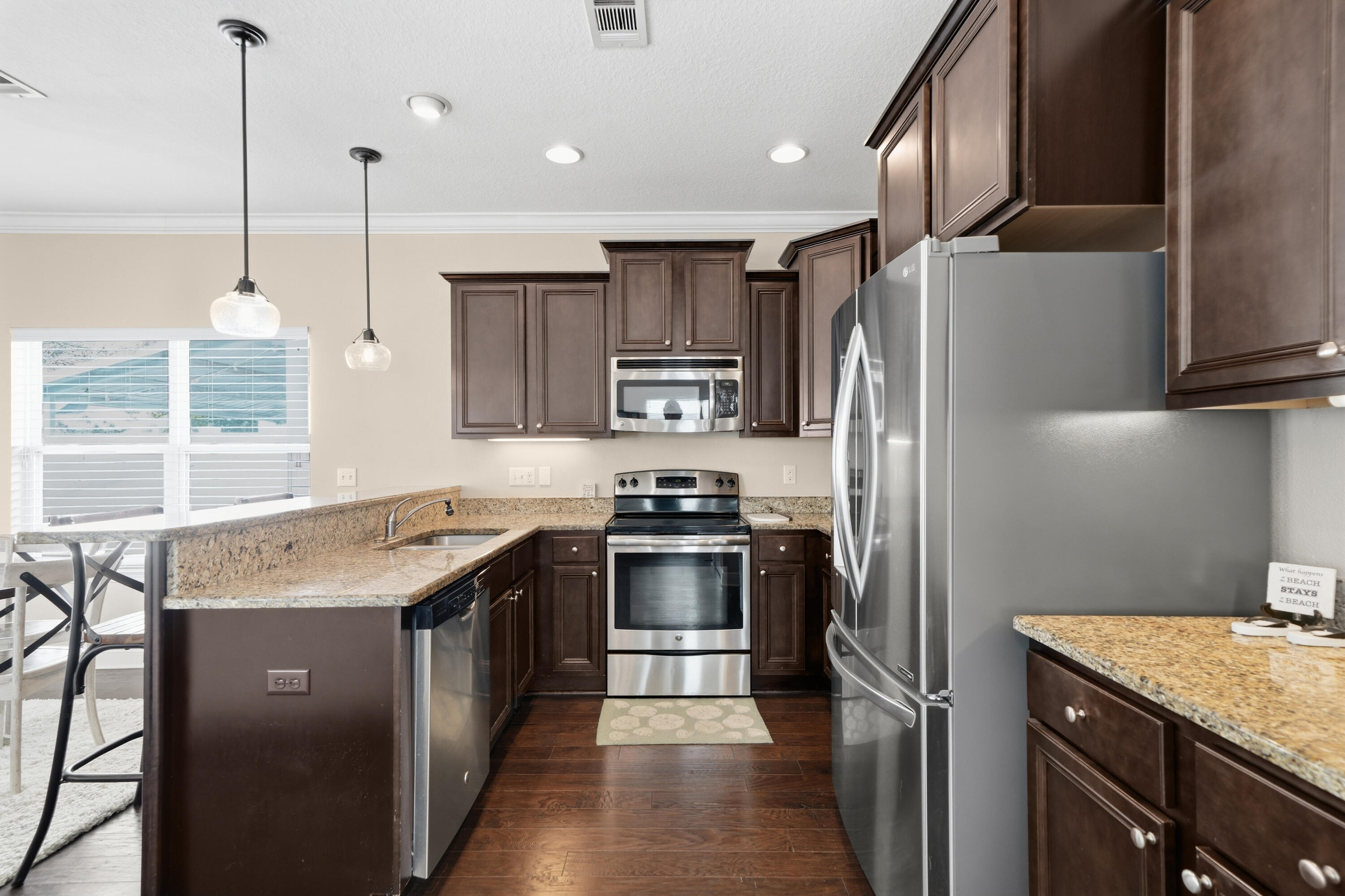 135 Grayling Way Inlet Beach, FL 32461 - Photo 34 of 61 a kitchen with stainless steel appliances granite countertop a refrigerator a sink a stove and a oven