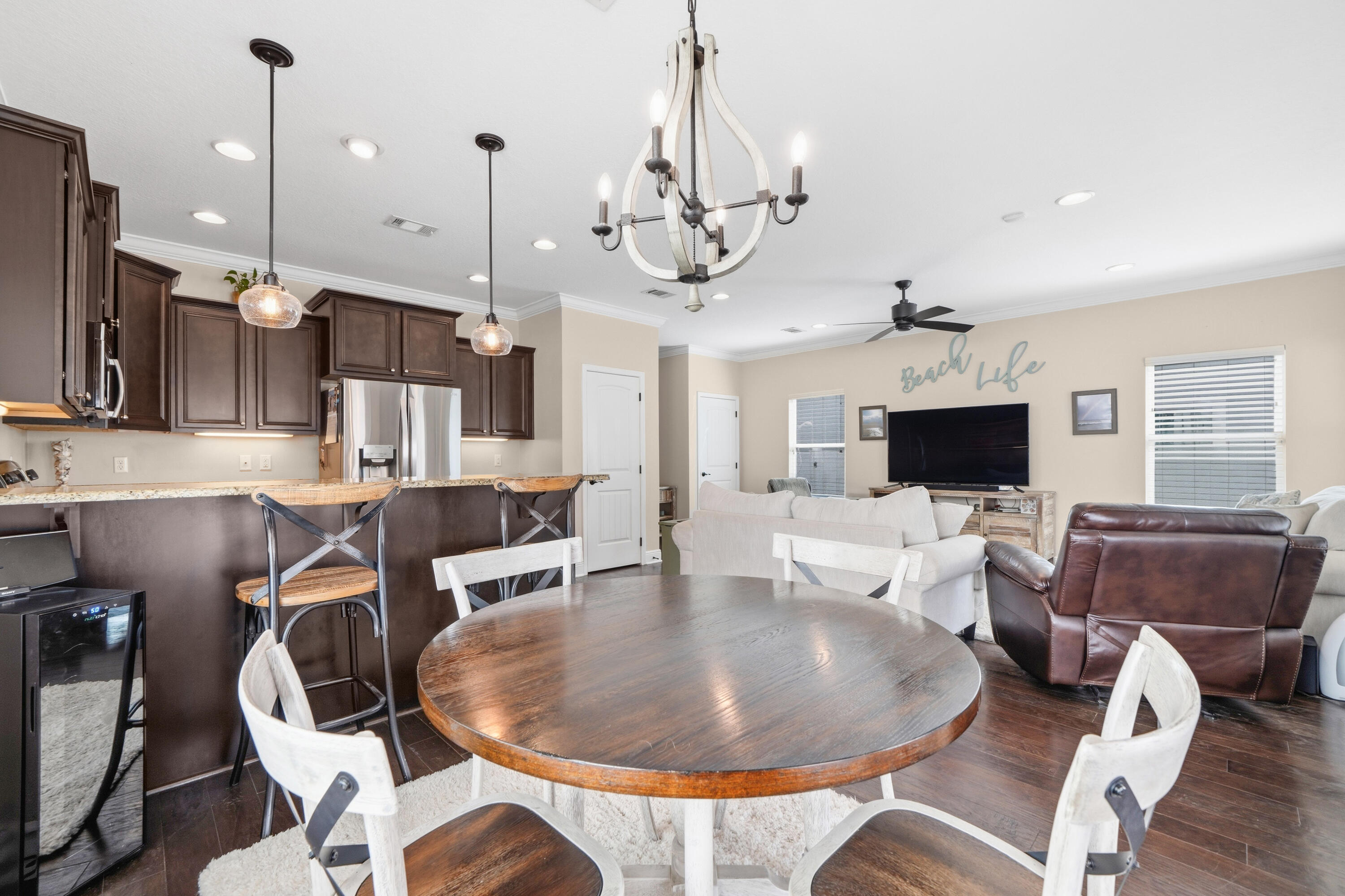 135 Grayling Way Inlet Beach, FL 32461 - Photo 38 of 61 a living room with furniture a flat screen tv and kitchen view