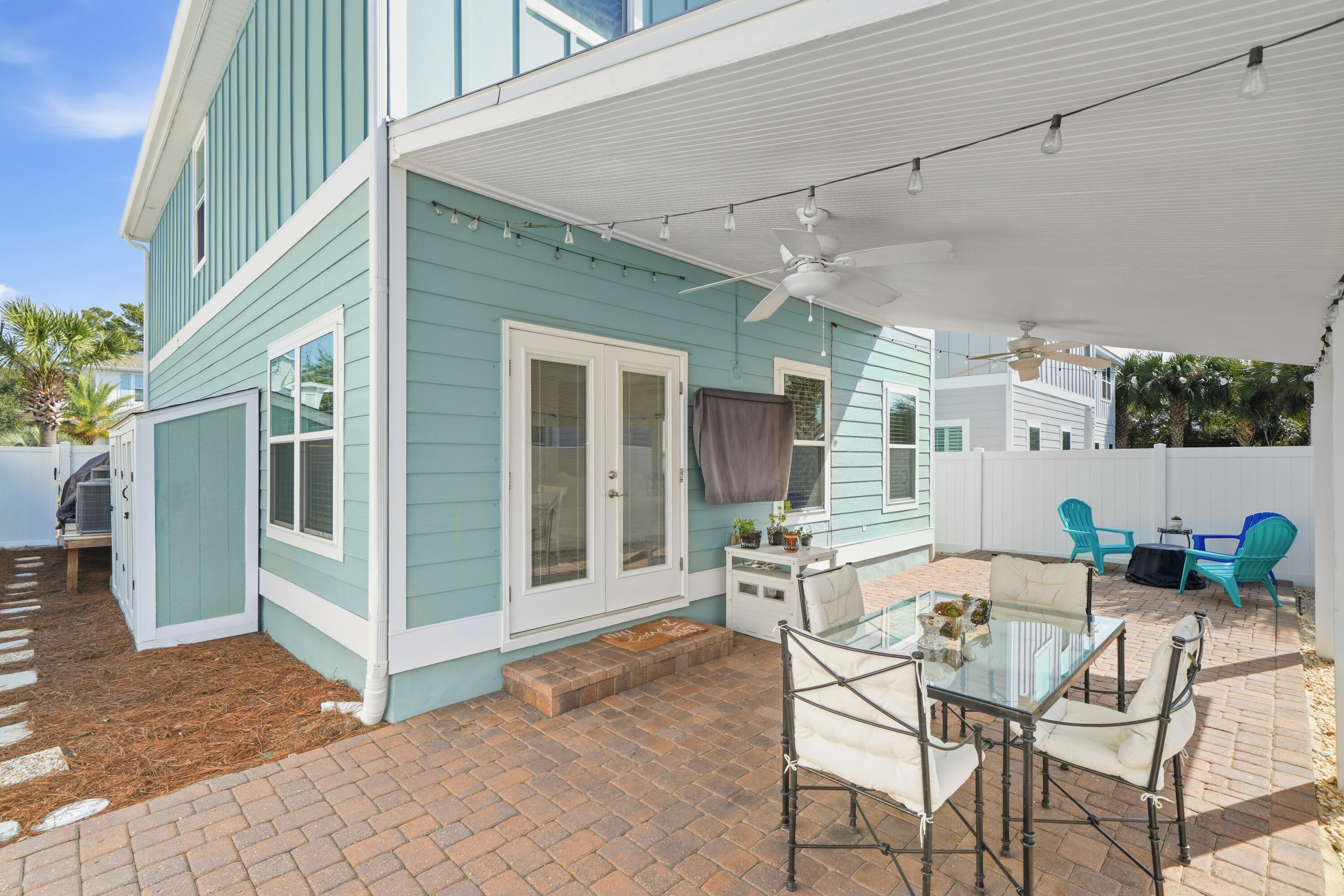135 Grayling Way Inlet Beach, FL 32461 - Photo 39 of 61 a view of a patio with table and chairs and potted plants