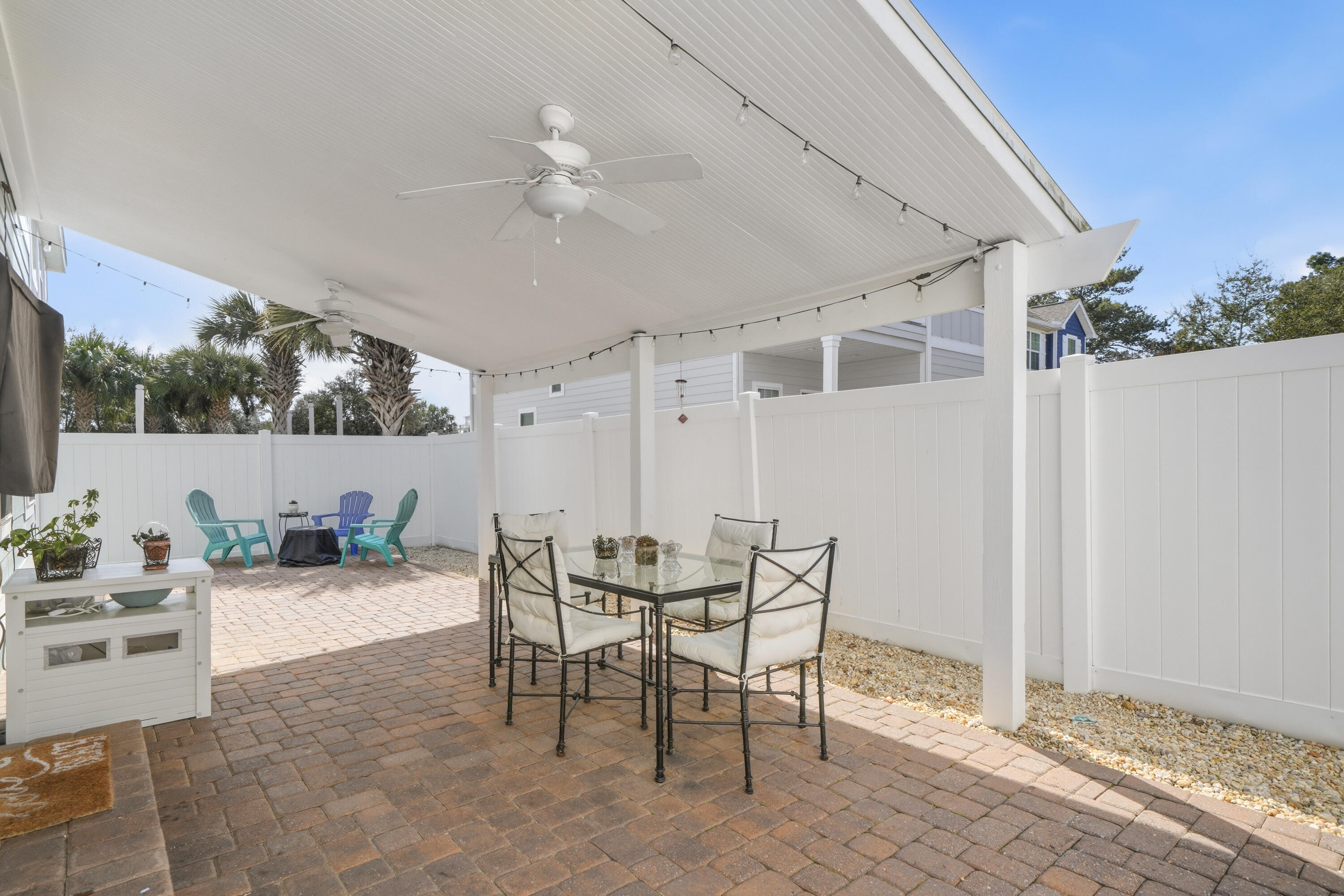135 Grayling Way Inlet Beach, FL 32461 - Photo 40 of 61 a view of a patio with table and chairs and potted plants