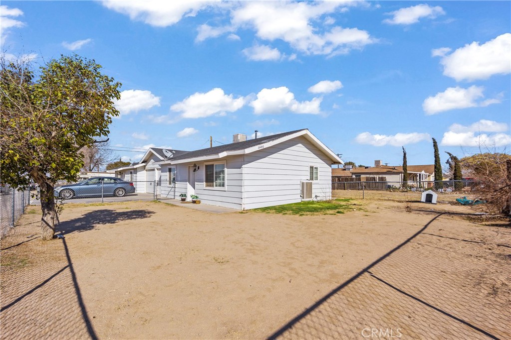 16490 Pine Street Hesperia, CA 92345 - Photo 2 of 2 a view of a house with swimming pool and sitting area