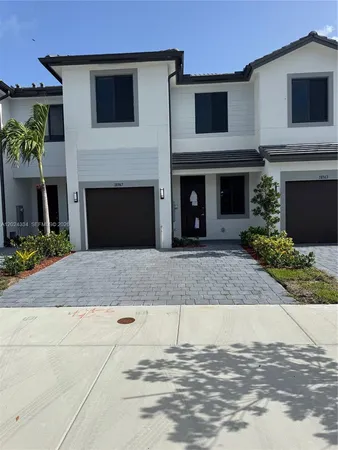 a front view of a house with a garage