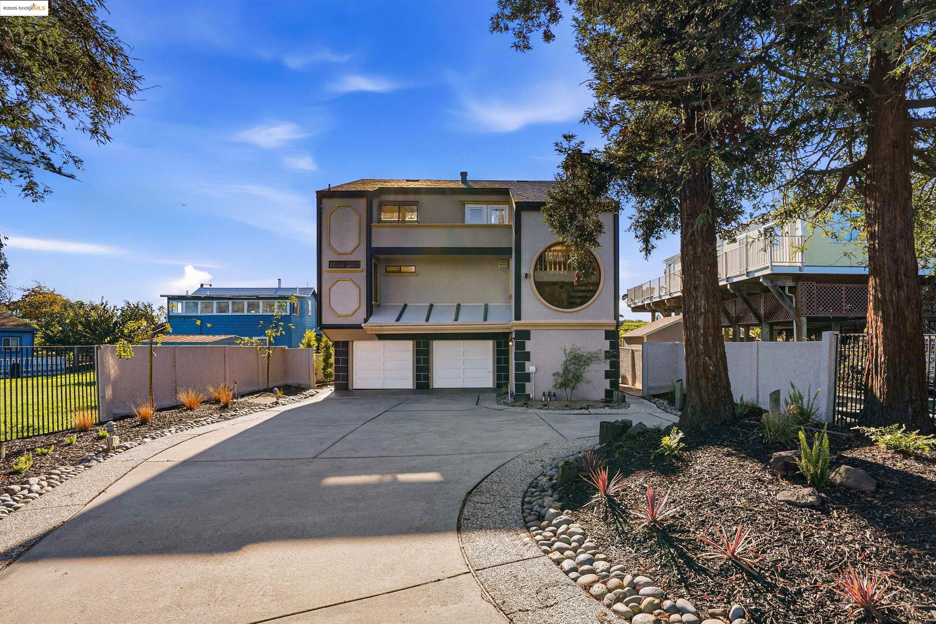 2796 Taylor Road Bethel Island, CA 94511 - Photo 2 of 49 View of property featuring an attached garage and concrete driveway