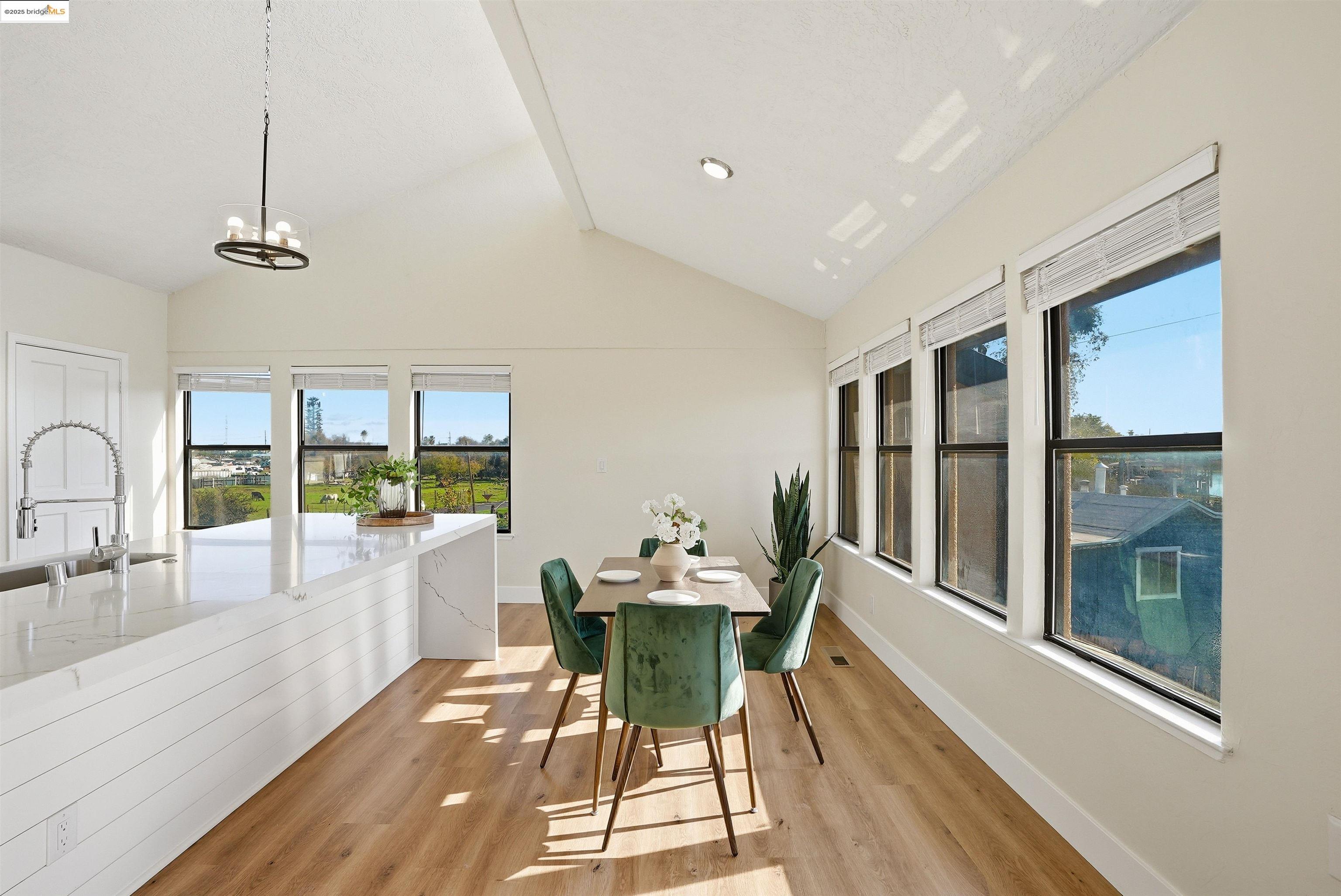 2796 Taylor Road Bethel Island, CA 94511 - Photo 9 of 49 Dining space with vaulted ceiling and light wood-style flooring