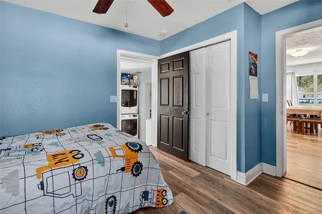 a bedroom with a bed and a dresser