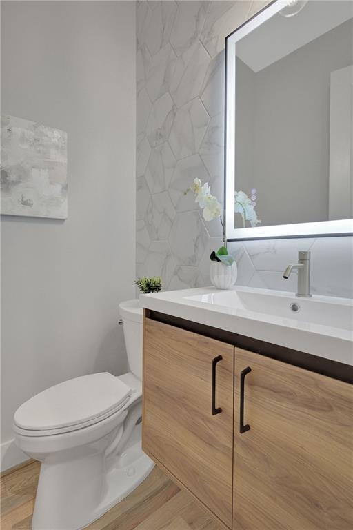 458 Connally Street Southeast Atlanta, GA 30312 - Photo 18 of 51 a bathroom with a sink a toilet and mirror