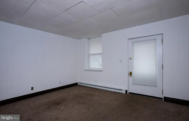an empty room with a empty space and window