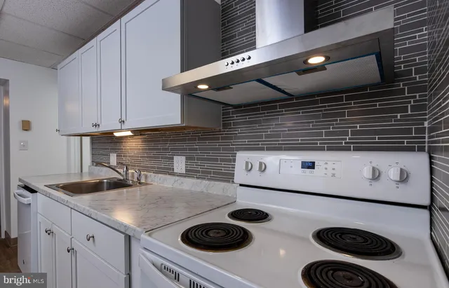 a kitchen with a stove and a microwave