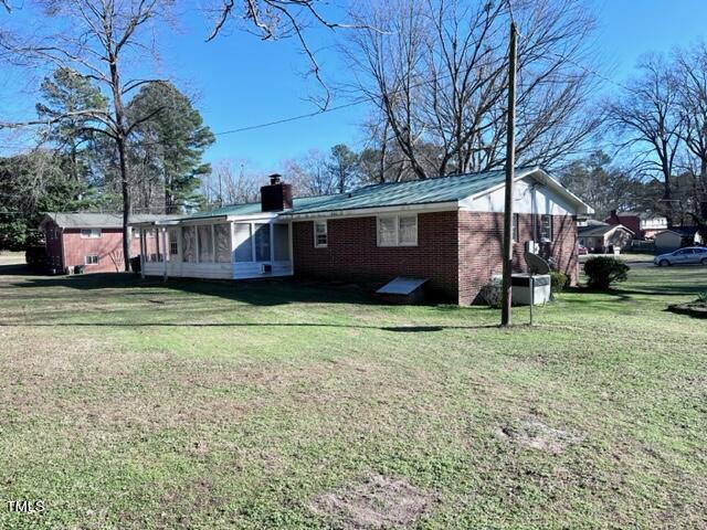 504 Winterlochen Road Raleigh, NC 27603 - Photo 5 of 39 a house view with a garden space