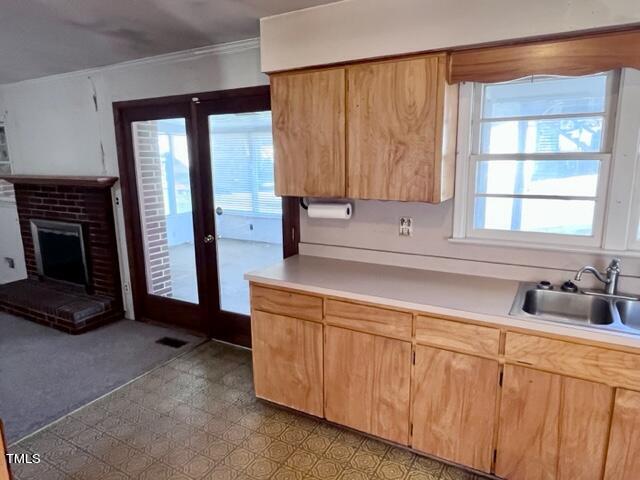 504 Winterlochen Road Raleigh, NC 27603 - Photo 9 of 39 a kitchen with a sink and a window