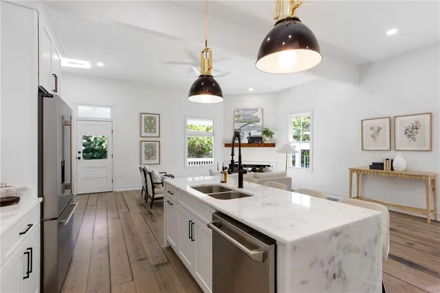 a kitchen with sink and center island