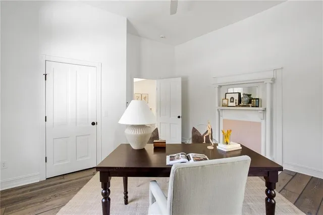 a living room with furniture a wooden floor and a table