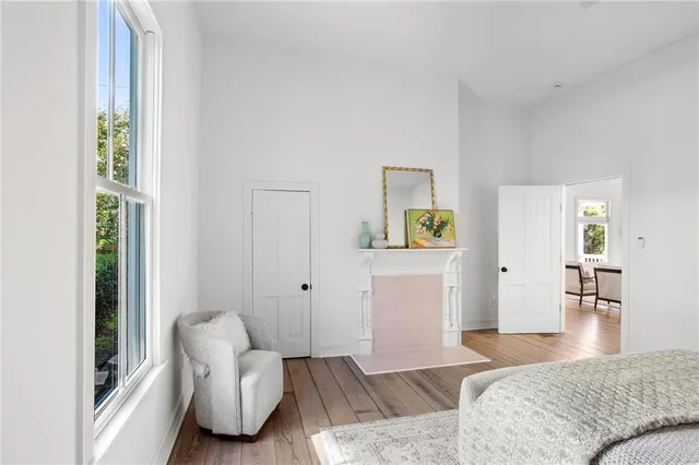 a bedroom with furniture and a wooden floor