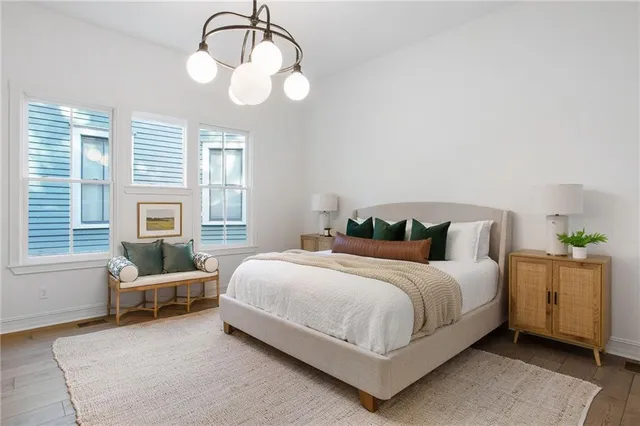 a bedroom with a bed and window