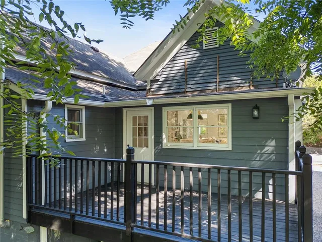 a view of a porch with a small yard