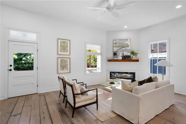 a living room with furniture and a potted plant