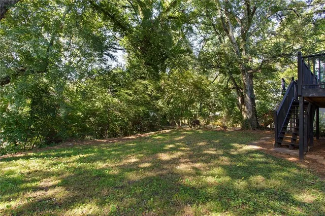 a view of outdoor space with deck and yard