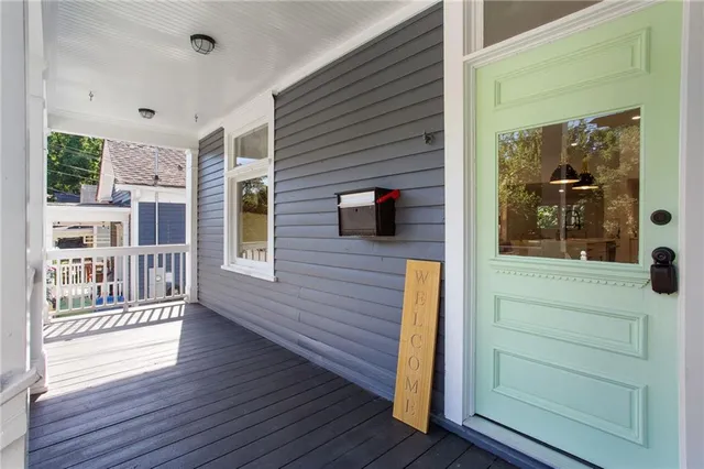 a view of a house with a door and wooden floor