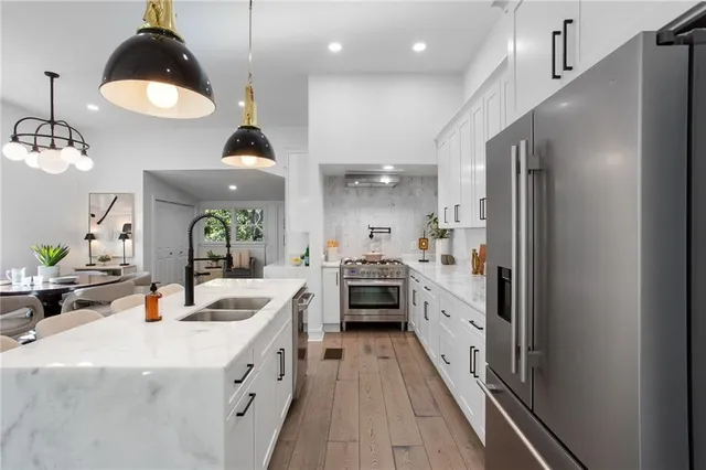 a kitchen with counter top space a sink and cabinets