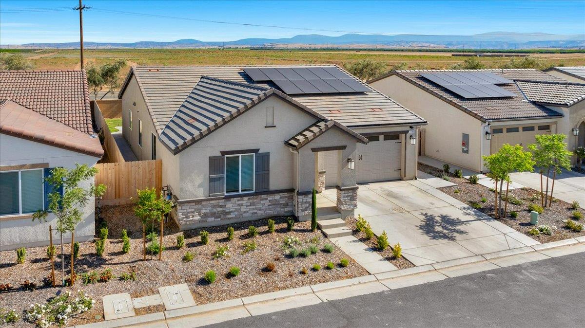 a view of a house with outdoor space and sitting area