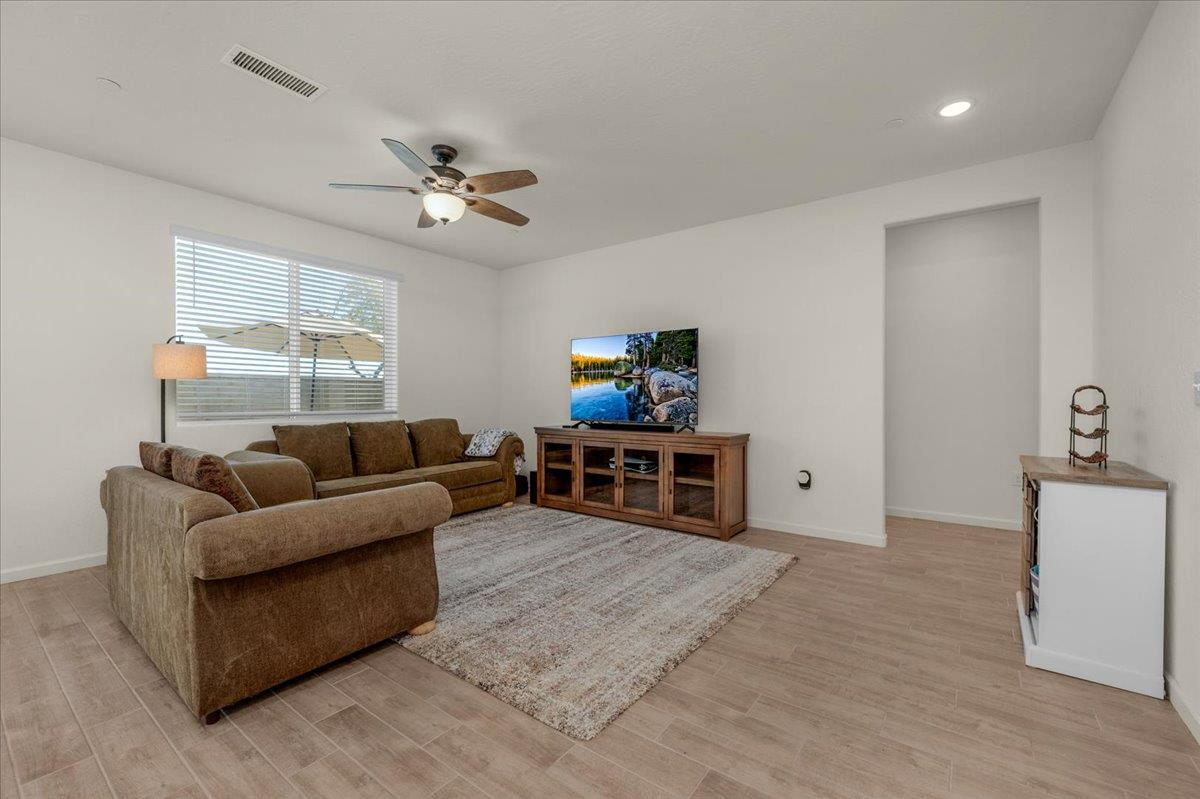 1183 Encore Way West Madera, CA 93636 - Photo 16 of 46 a living room with furniture and a flat screen tv