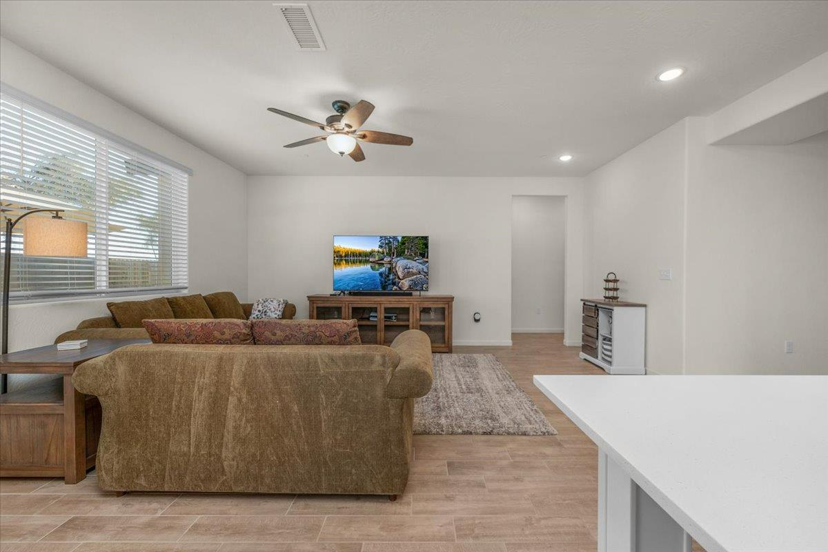 1183 Encore Way West Madera, CA 93636 - Photo 17 of 46 a living room with furniture and a flat screen tv