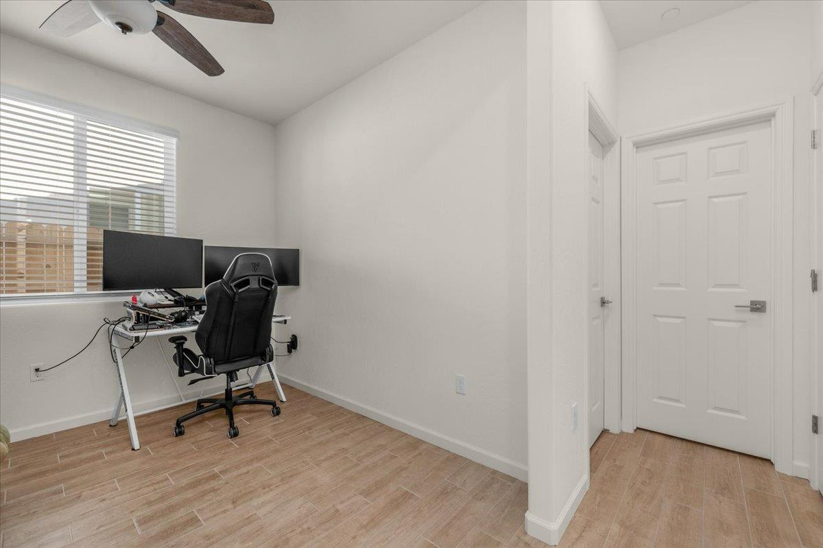 1183 Encore Way West Madera, CA 93636 - Photo 23 of 46 a view of a workspace with furniture and a window