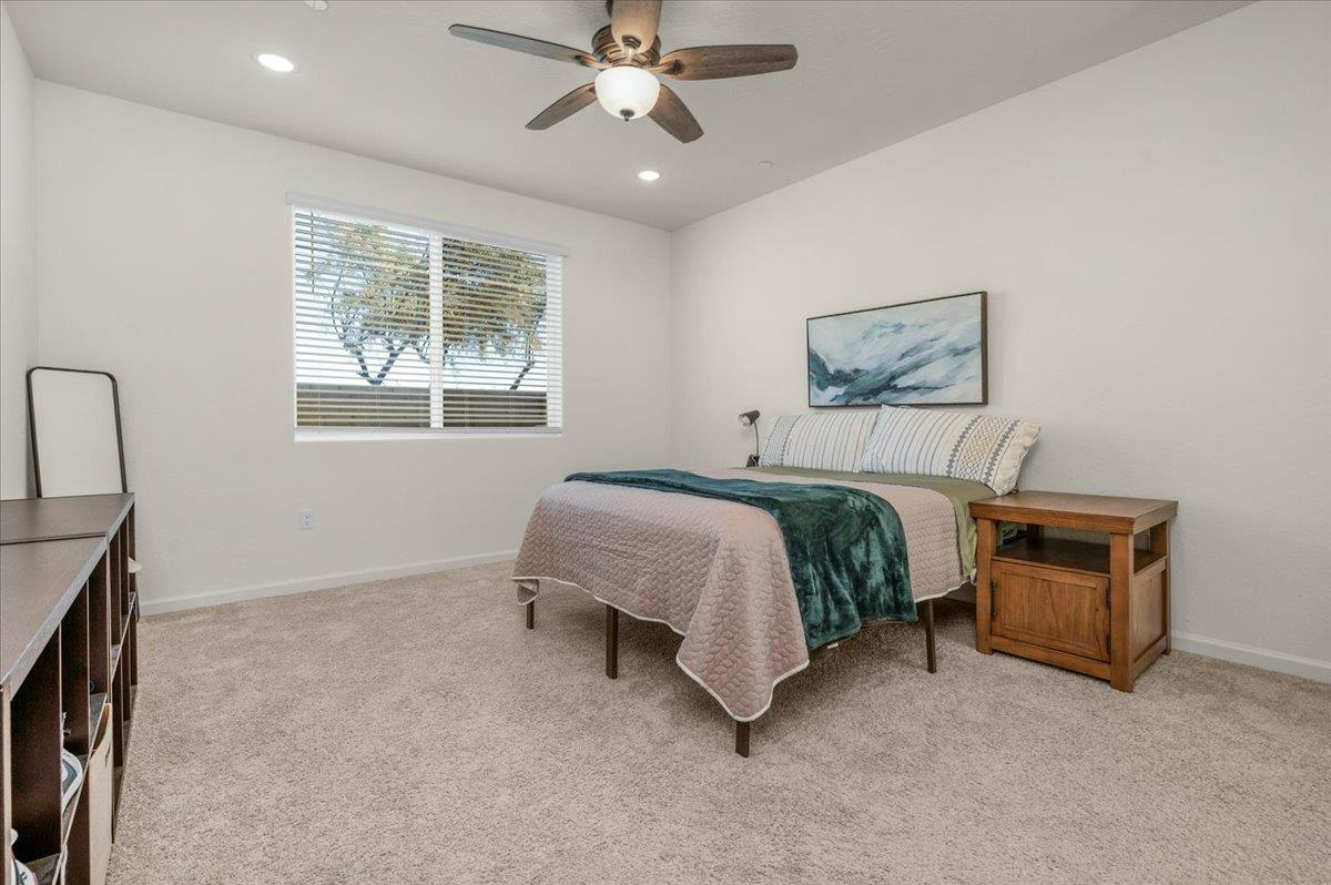 1183 Encore Way West Madera, CA 93636 - Photo 28 of 46 a bedroom with a bed furniture and a window