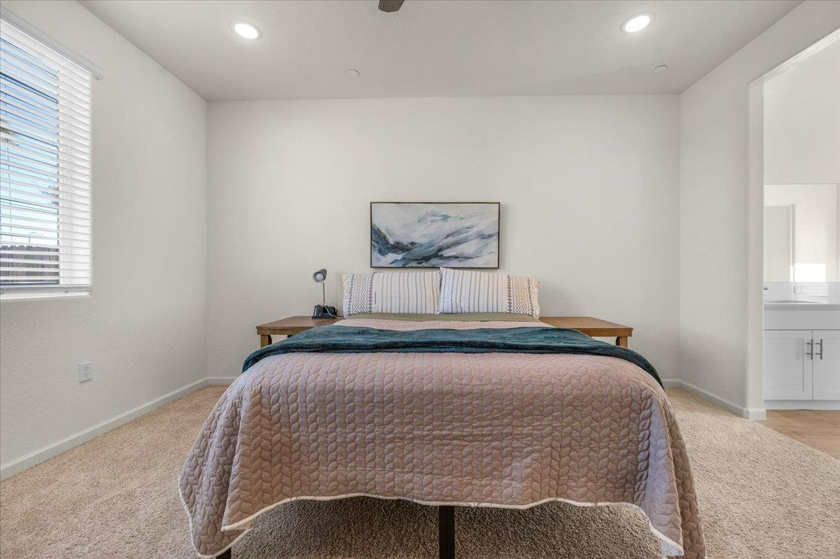 1183 Encore Way West Madera, CA 93636 - Photo 29 of 46 a bedroom with a bed and a window