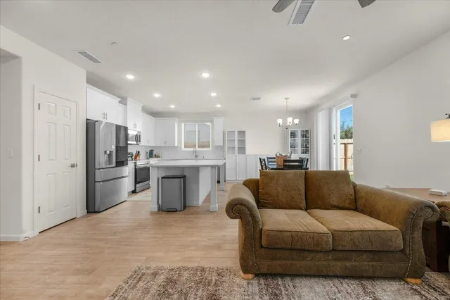 a kitchen with refrigerator and window