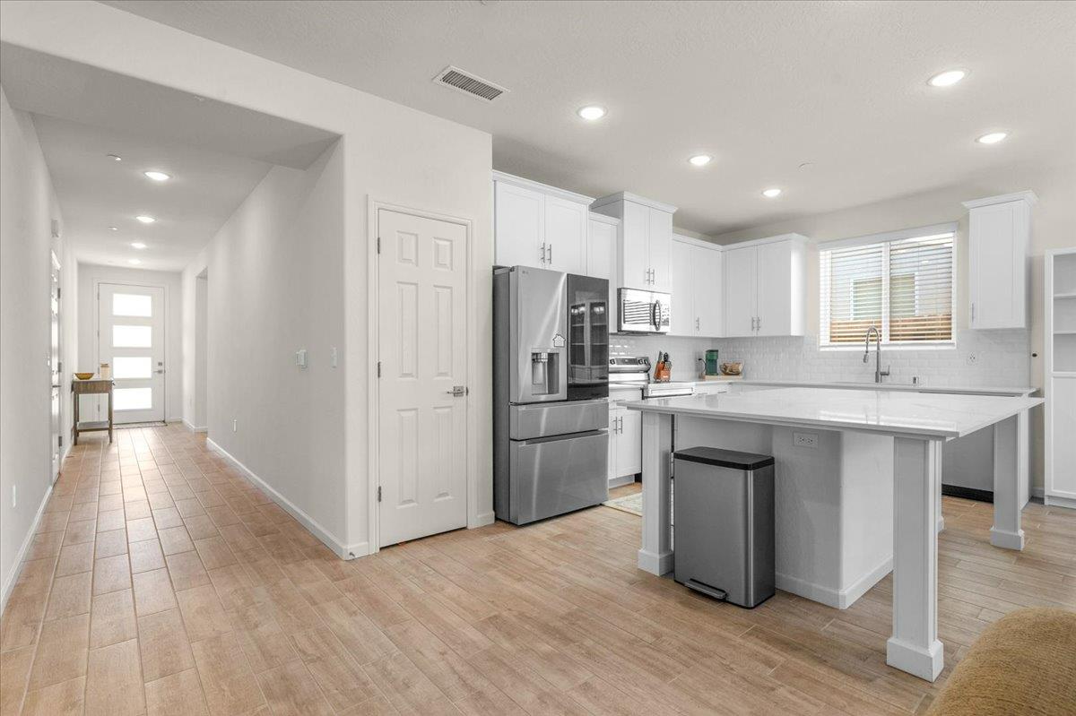 1183 Encore Way West Madera, CA 93636 - Photo 38 of 46 a kitchen with refrigerator and window