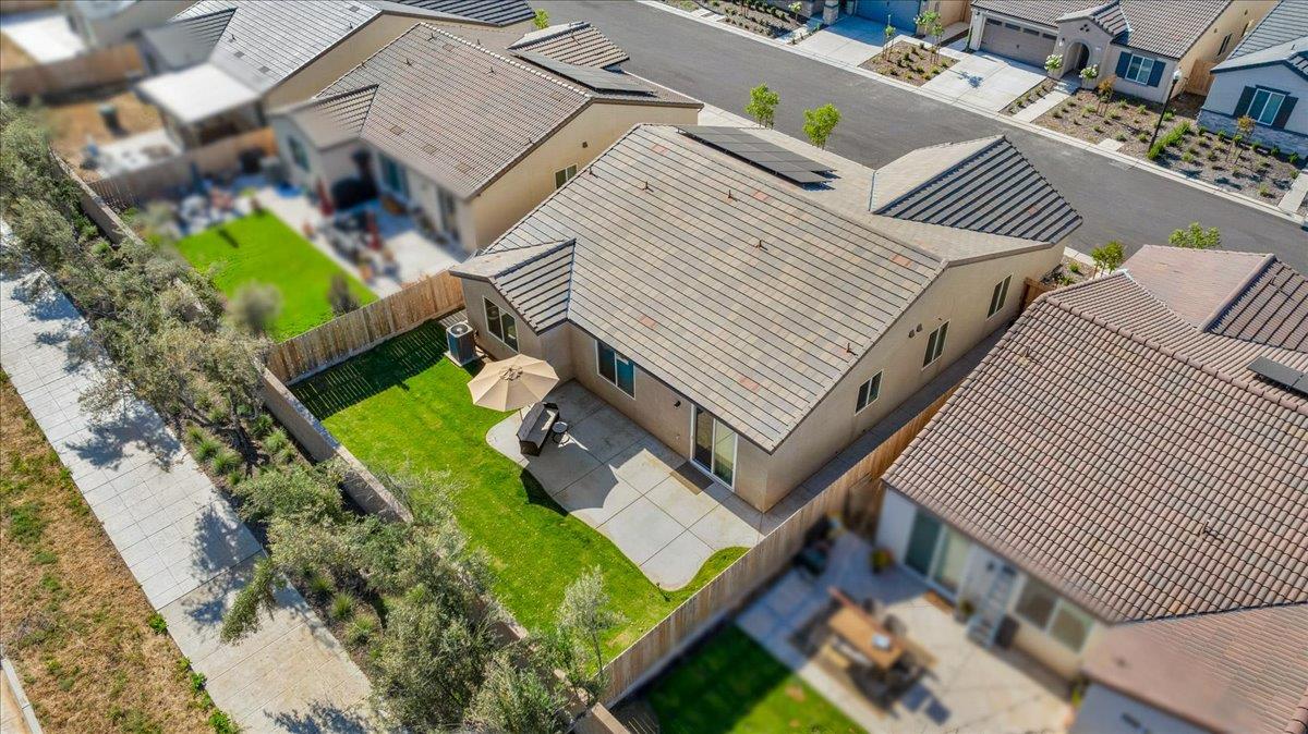 1183 Encore Way West Madera, CA 93636 - Photo 43 of 46 an aerial view of a house with a garden and deck