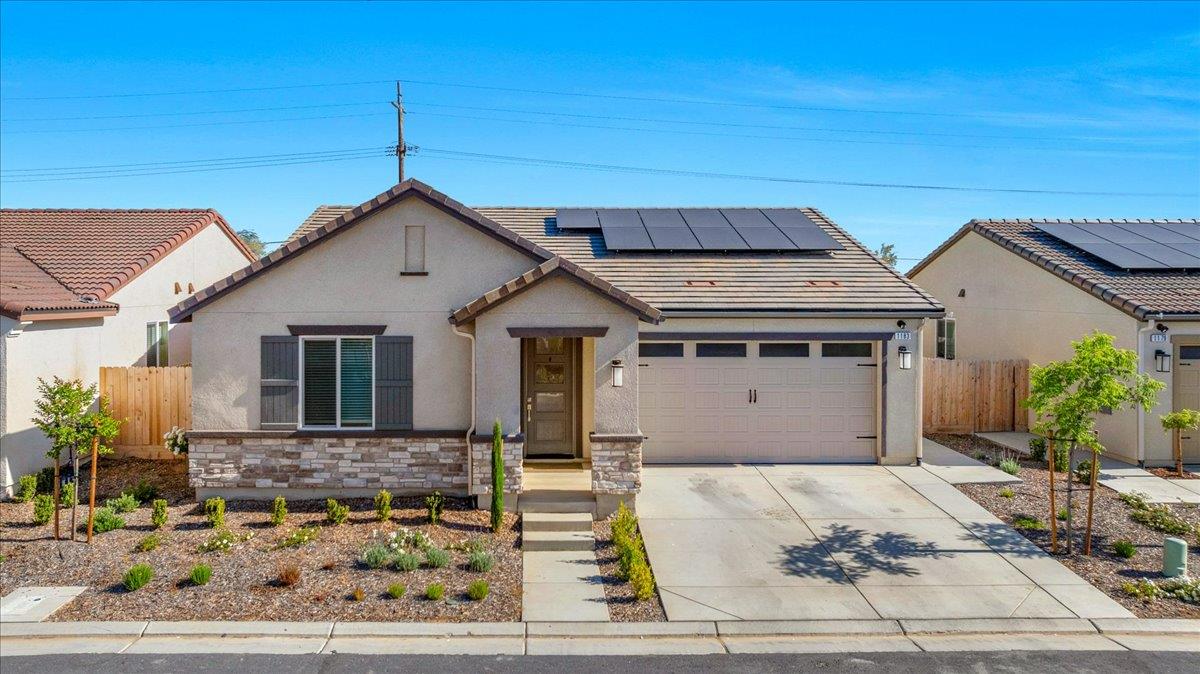 1183 Encore Way West Madera, CA 93636 - Photo 45 of 46 a front view of a house with garden