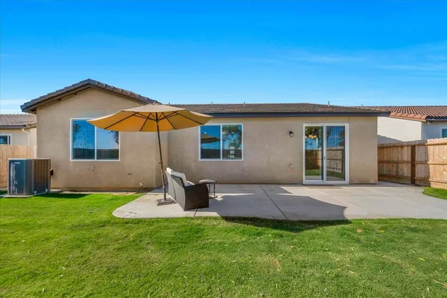 a backyard of a house with seating space