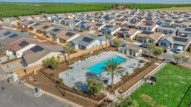 an aerial view of a house with a garden