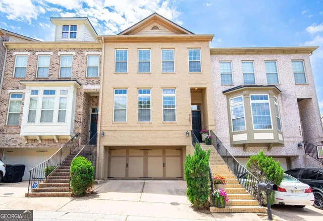 a front view of a building with garden